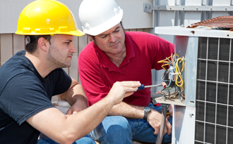 Technicians Repairing AC Unit in Windham, NH