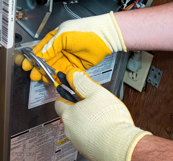Technician Installing New Heating Unit in Windham, NH